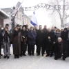 Israel Parliament members pose for a group picture at the entrance to the Auschwitz concentration camp in Poland on International Holocaust Remembrance Day, Jan. 27, 2010. Photo by Isaac Harari/Flash90.