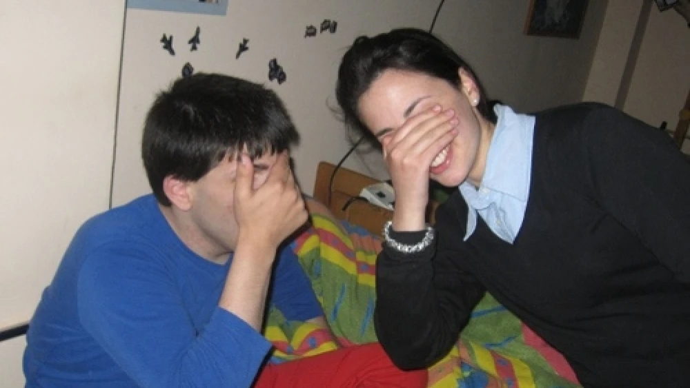 Click photo to download. Caption: A seminary student (right) participates in the "Sweet Dreams" program for the benefit of special-needs children at ALEH Jerusalem. Credit: Courtesy ALEH.