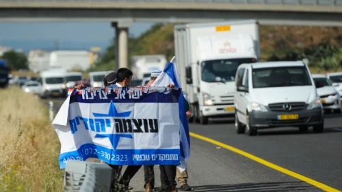 Right-wing activists and members of Otzma Yehudit movement seen at Eyal Interchange after the police stopped their bus on their way to protest in Umm al-Fahm, April 10, 2018. Photo by Basel Awidat/Flash90.