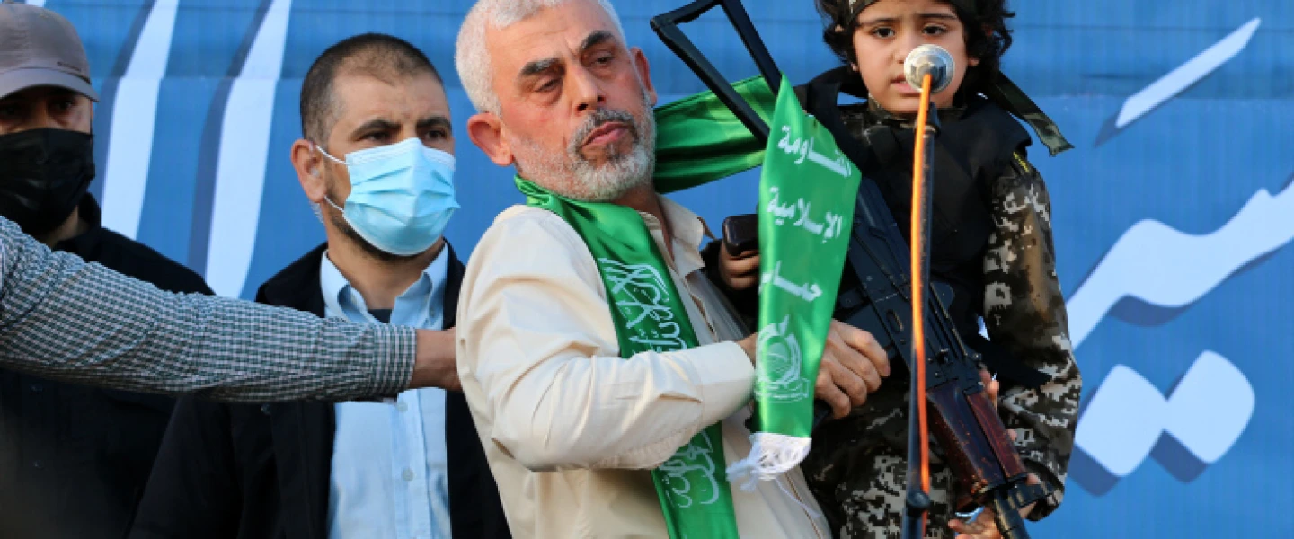 Hamas chief in Gaza Yahya Sinwar holds a boy dressed as a Hamas terrorist during a rally in Gaza City, May 24, 2021. Photo by Atia Mohammed/Flash90.