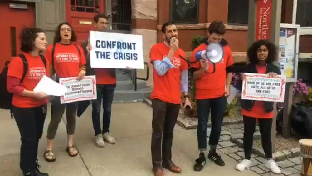 Nadav David, who was recently honored by Combined Jewish Philanthropies, at a rally tied to IfNotNow, outside of Hillel at Northeastern University in April 2019. Source: Screenshot.