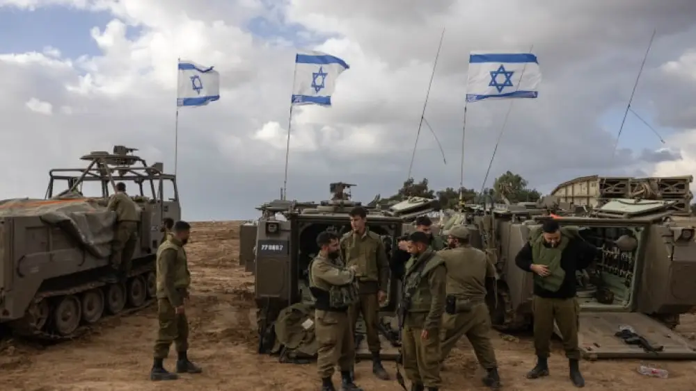Israeli soldiers and armored personnel carriers near the Gaza border, Nov. 20, 2023. Photo by Chaim Goldberg/Flash90.