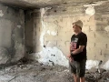Gadi Moses stands amid the ruins of a house in Kibbutz Nir Oz, Aug. 26, 2025. Photo by Amelie Botbol.