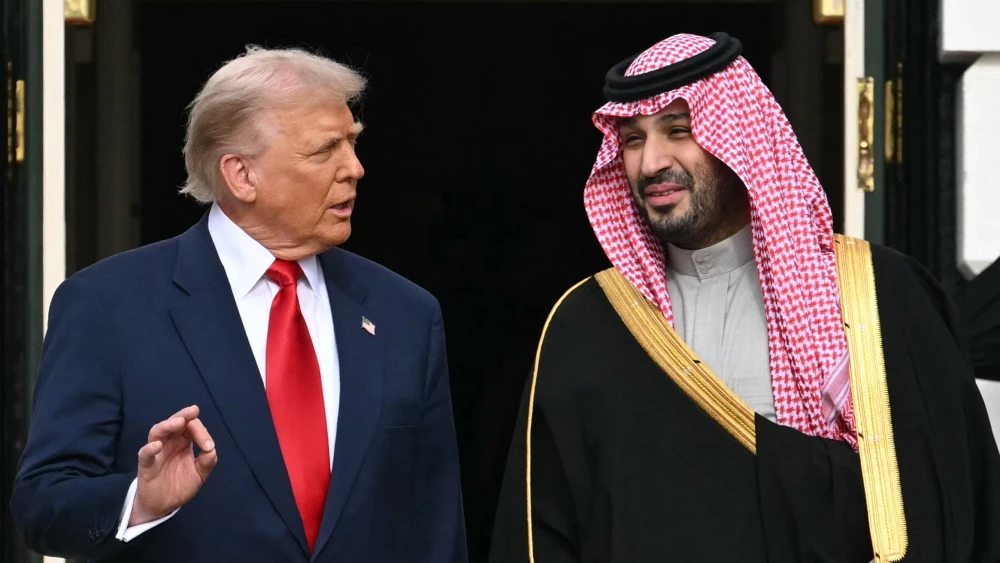 U.S. President Donald Trump greets Crown Prince and Prime Minister of the Kingdom of Saudi Arabia Mohammed bin Salman on the South Lawn at the White House in Washington, D.C., Nov. 18, 2025. Photo by Saul Loeb/AFP.