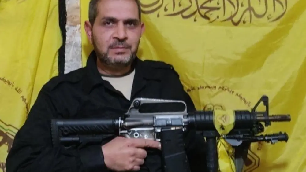 Alam al-Ra'ai poses with an automatic rifle. Credit: Israel Security Agency.