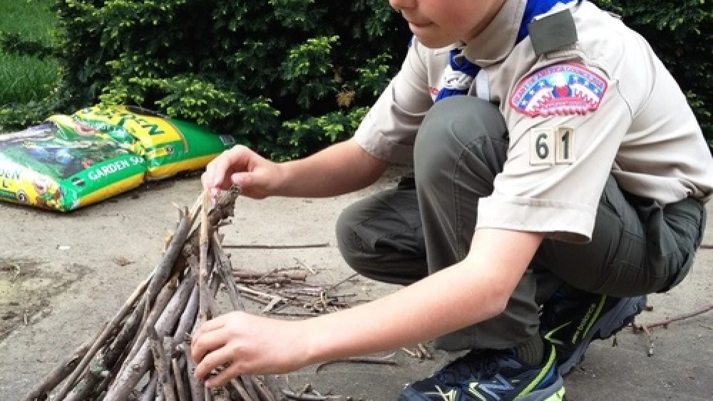 Click photo to download. Caption: Click photo to download. Caption: Boy Scout Abraham “Avi” Brudoley makes a bonfire. Credit: Maayan Jaffe.