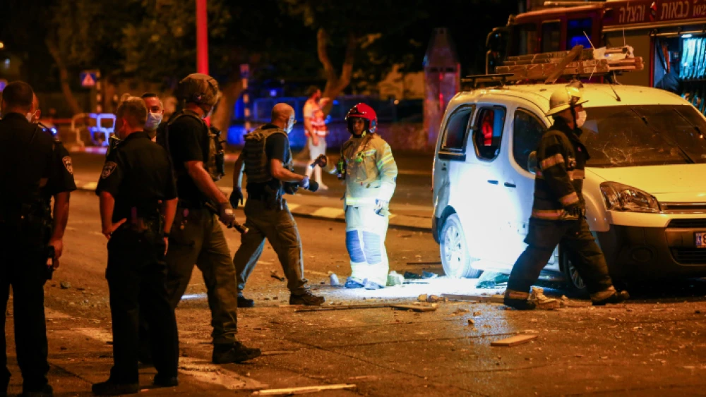 Israeli Police and medical personnel at the scene where a rocket fired from the Gaza Strip hit a road in the southern Israeli city of Ashdod on Sept. 15, 2020. Photo by Flash90.