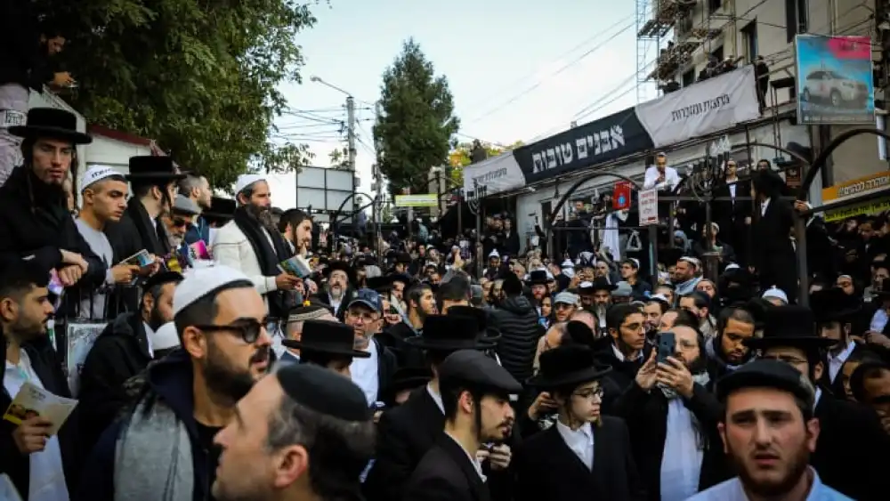 Jewish men in the street near the tomb of Rabbi Nachman of Breslov in Uman on eve of Rosh Hashanah, Sept. 25, 2022. Credit: Flash90.
