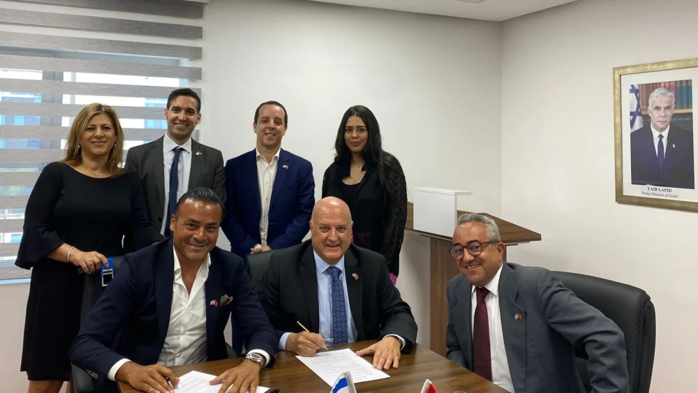 Israel's Ambassador in Morocco David Govrin (center) signs a contract to build an embassy in Rabat, Aug. 2, 2022. Source: Twitter/David Govrin.