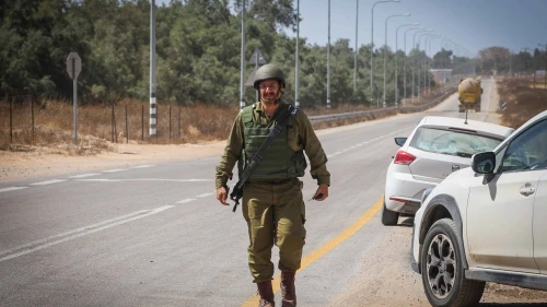 An IDF soldier near the Kerem Shalom Crossing to Gaza after mortar shells fired from the Strip hit the area, May 5, 2024. Credit: Flash90.