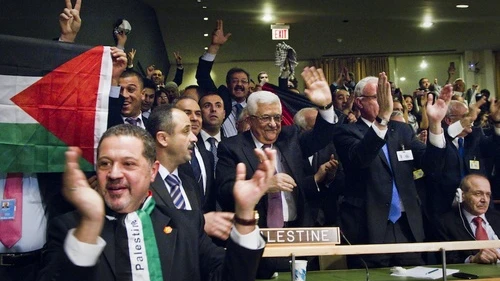 Members of the Palestinian delegation at the United Nations General Assembly celebrate on Nov. 29, 2012, upon the vote to upgrade Palestinian status to a nonmember observer state in the U.N. Credit: UN/Rick Bajornas.