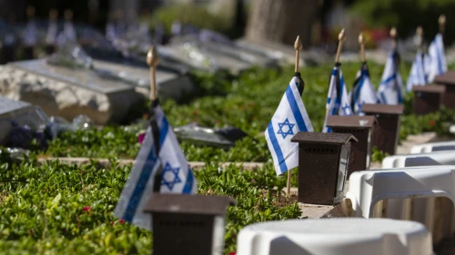 Israeli flags placed by each grave in the military cemetery of Netanya, ahead of the Israel's Memorial Day for fallen soldiers and victims of terror, on May 7, 2019. Photo by Flash90.