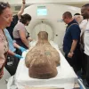 Staff from the Israel Museum and Shaare Zedek Medical Center run a CT scan on a 2,000-year-old Egyptian coffin lid, May 19, 2023. Credit: Shaare Zedek Medical Center.