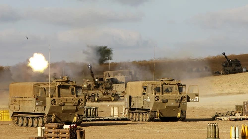 The Israel Defense Forces Artillery Corps fires shells at Gaza on July 18, 2014, after Israeli forces began a ground invasion into northern Gaza amid "Operation Protective Edge." Following the operation, Hamas continues to control Gaza and openly considers any truce with Israel as a time to re-arm for the next conflict. Credit: Miriam Alster/Flash90.