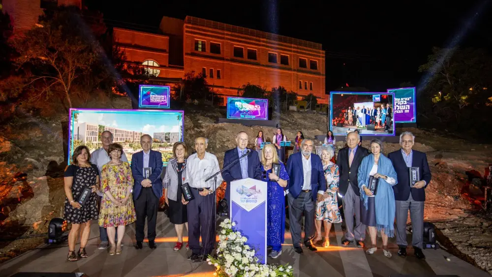 JCT vice president Stuart Hershkowitz poses with major donors at the site of the new Tal Campus for women. Photo by Yechiel Itkin.
