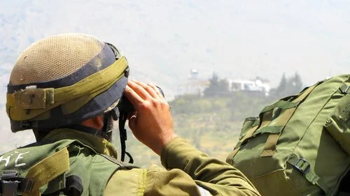 An Israeli soldier patrols near the Israel-Syria border in the Golan Heights. Credit: IDF.