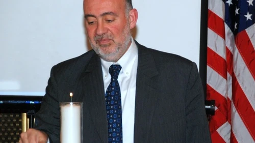 Click photo to download. Caption: On Monday night in New York, Ron Prosor, Israel’s Permanent Representative to the United Nations, lights a candle at a memorial for the 20th anniversary of the Israeli embassy bombing in Buenos Aires, Argentina. Credit: Maxine Dovere.