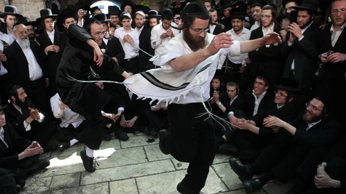 Orthodox Jewish men dance as they take part in celebrations of the Jewish holiday of Lag B'Omer at Mount Meron in northern Israel on May 22, 2013. Credit: Yaakov Naumi/Flash90.