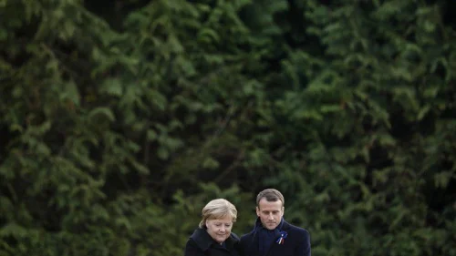 French President Emmanuel Macron and German Chancellor Angela Merkel embrace at a ceremony commemorating the centennial of the end of World War I. Credit: Emmanuel Macron via Twitter.