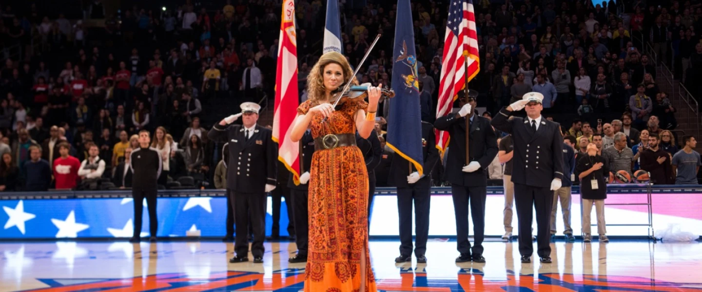 The violinist Miri Ben-Ari performs during the Euro Classic between Maccabi FOX Tel-Aviv and EA7 Armani Milano in Madison Square Garden in New York City on Oct. 4, 2015. Credit: Shutterstock.