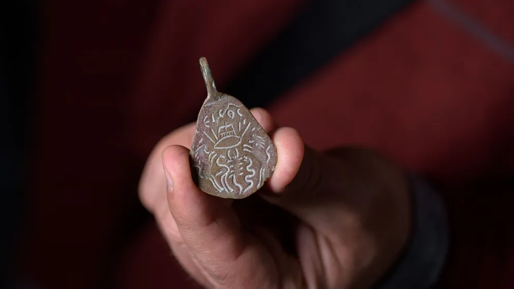 An ancient amulet that was found 40 years ago in the Galilee and recently handed over to the National Treasures Center. Credit: Dafna Gazit/Israel Antiquities Authority.