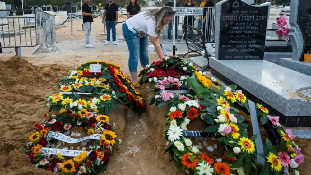 The graves of Shay Silas Nigreke and his son Aviad Nir, who were murdered in Huwara on Saturday, Aug/ 20, 2023. Photo by Flash90.