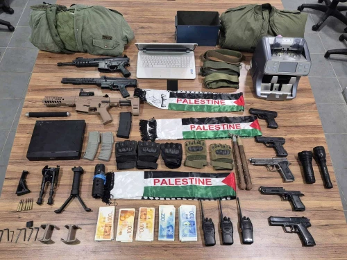 Terrorist funds, weapons and other combat equipment seized by Israelis security forces during a raid in the Palestinian village of Barta'a, Aug. 6, 2025. Credit: Israel Police.