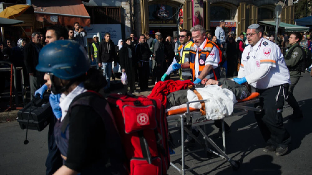 Israeli rescue personnel respond to a Palestinian terror attack near Jerusalem's Damascus Gate on Feb. 3, 2016. The initial "CBS News" headline for a story about that attack stated, "3 Palestinians killed as daily violence grinds on," failing to identify those Palestinians as the terrorists who carried out the attack and neglecting to mention the attack's Israeli victim, policewoman Hadar Cohen. Credit: Johanna Geron/Flash90.