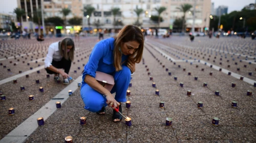 Israelis prepare for a display of 25,000 memory candles in honor of the 25th Memorial Day for the assassination of Prime Minister Yitzhak Rabin at Rabin Square in Tel Aviv on Oct. 29, 2020. Photo by Tomer Neuberg/Flash90.