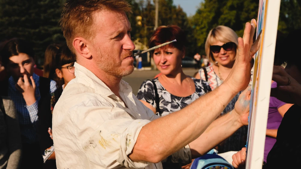 Alon Meyer, a Berlin-based artist born in St. Petersburg, is shown making art in Ukraine. Credit: Courtesy.