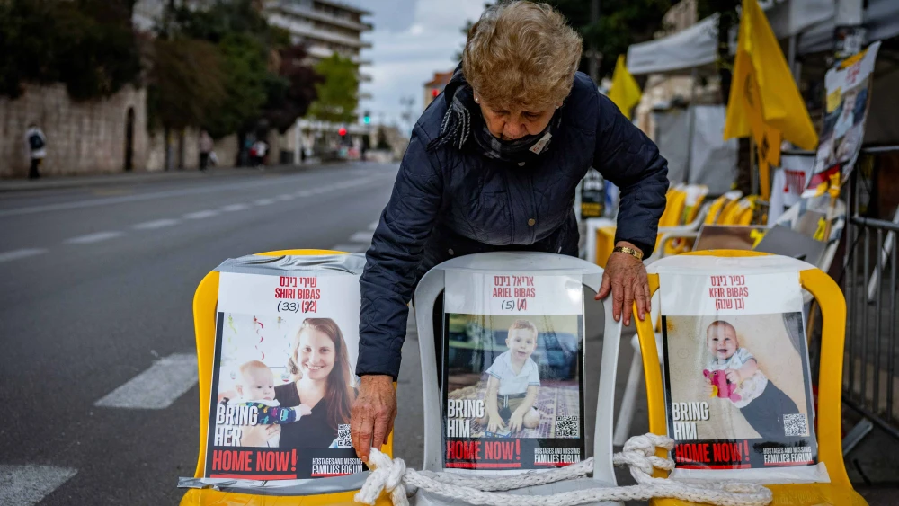 Pictures of Shiri Bibas and her children Kfir and Ariel who are held hostage in Hamas captivity hang outside the protest tent calling for the release of Israeli hostages in the Gaza Strip, outside the Prime Minister's Residence in Jerusalem, Feb. 19, 2025. Photo by Chaim Goldberg/Flash90.