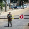Israeli soldiers block the entrance to the village of Beita in northern Samaria during searches for the terrorist who carried out an attack in Huwara, on Aug. 20, 2023. Photo by Nasser Ishtayeh/Flash90.