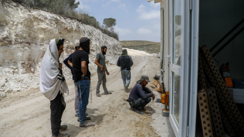 Jewish men work at the Homesh outpost in northern Samaria, May 29, 2023. Credit: Flash90.