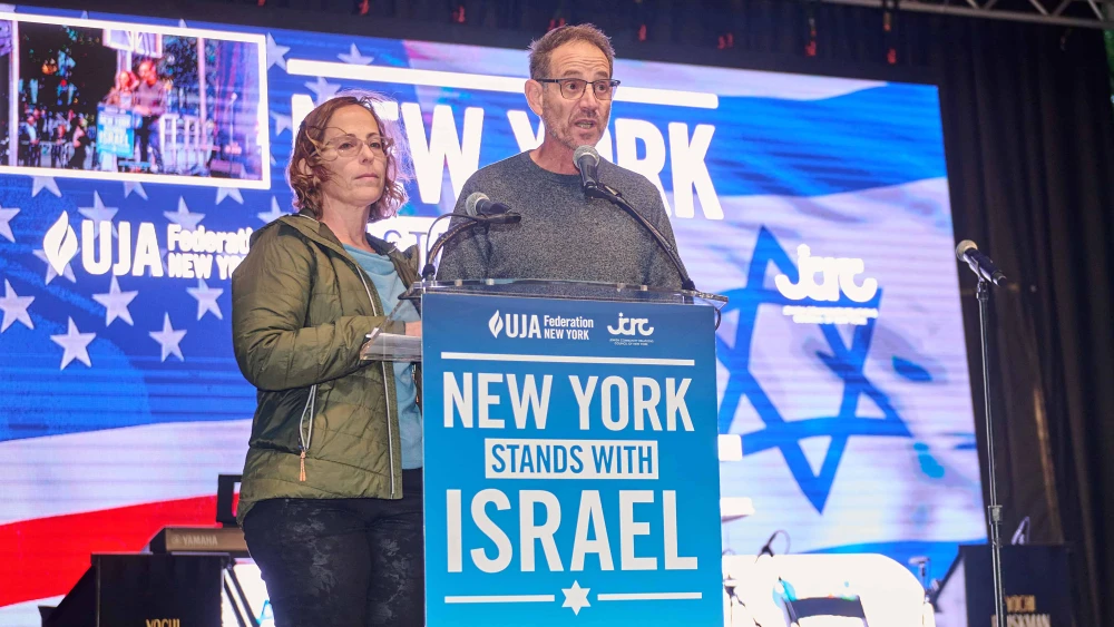 Ronen and Orna Neutra speak about their 21-year-old son, Omer, who is believed to be held by Hamas at the “New York Stands for Israel” rally and vigil on Oct. 10, 2023. Credit: Perry Bindelglass/JCRC.