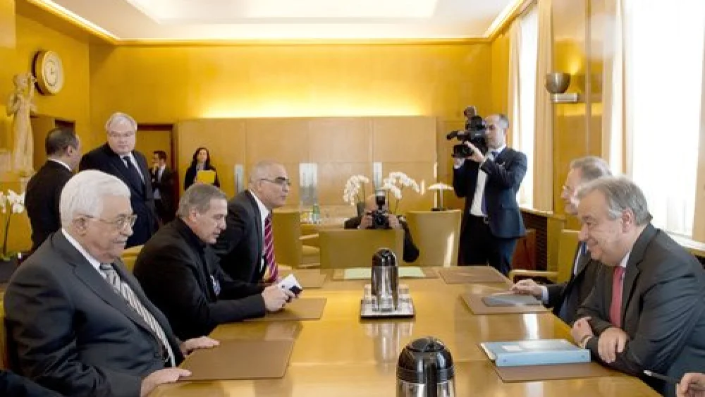 Palestinian Authority leader Mahmoud Abbas (in front, at left) sits across the table from U.N. Secretary-General António Guterres in Geneva on Feb. 27, 2017. Credit: U.N. Photo/Jean-Marc Ferré.