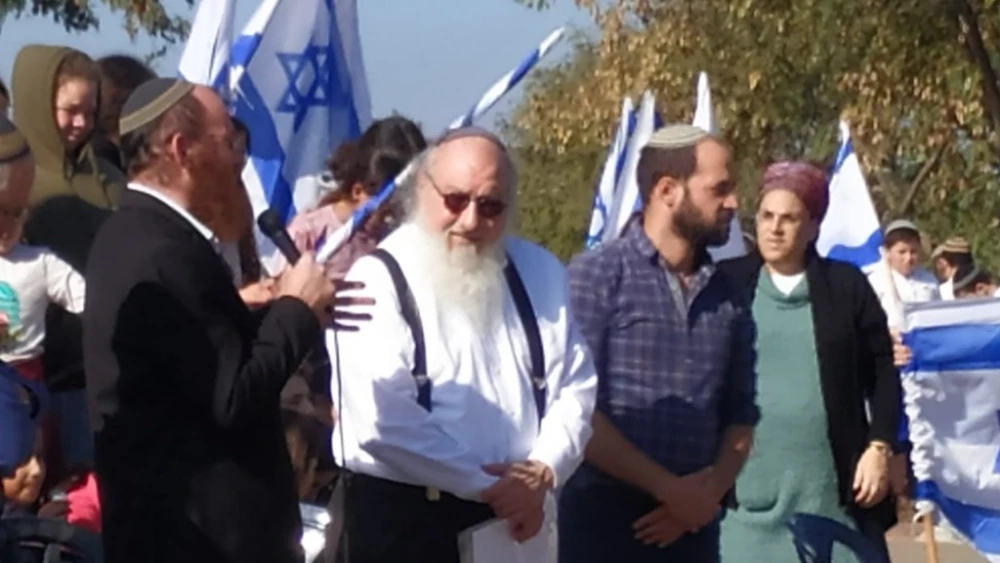 Residents of Elon Moreh in Samaria welcome Jonathan Pollard (center) on Dec. 16, 2022. Photo by Nadav Goldstein/TPS.