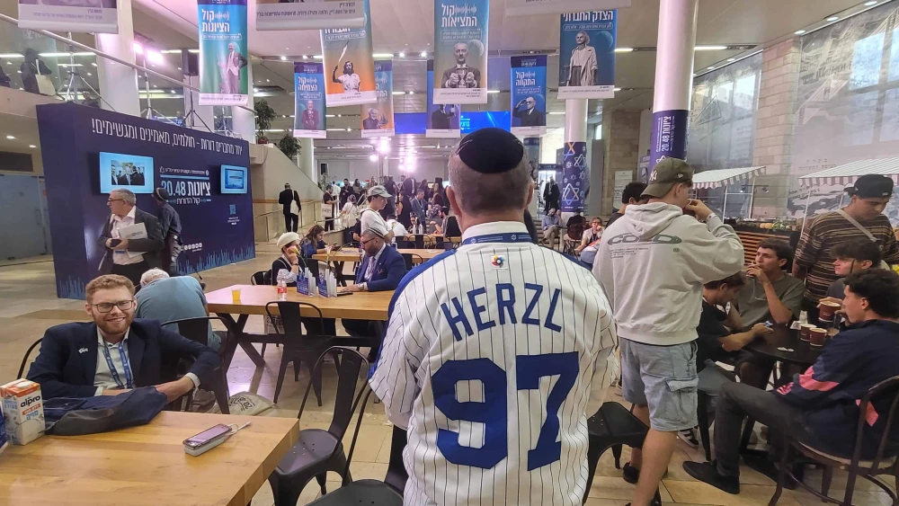 Herbert Block shows off the back of his Zionist-themed baseball uniform at the 39th World Zionist Congress in Jerusalem, Israel on Oct. 28, 2025. Photo by Canaan Lidor.