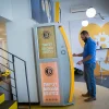 On Nov. 5, 2018, a man uses a bitcoin ATM machine at the Bitcoin Change center on Dizengoff Street in Tel Aviv. The center houses the ATM, as well as a museum on the history of the cryptocurrency. Credit: Miriam Alster/Flash90.