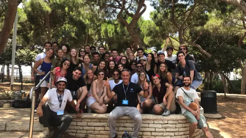 Birthright CEO Gidi Mark posing with trip participants in Israel. Credit: Courtesy.