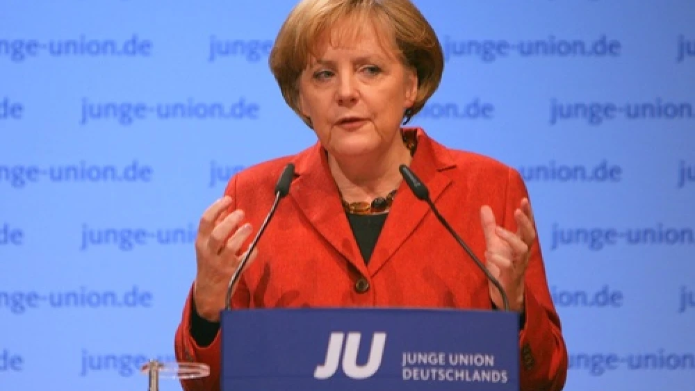 While German Chancellor Angela Merkel (pictured) has vowed that the German parliament will pass legislation legalizing circumcision in the fall, negotiations over the language of such a bill have revealed that many in the Bundestag may push for restrictions on the practice such as forcing the use of anesthetics or requiring a doctor to be present. Credit: Jacques Grießmayer.