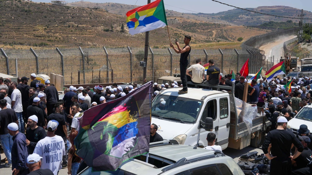 Druze residents protest near the Israeli-Syrian border fence in solidarity with their community in Syria, in Majdal Shams, July 16, 2025. Photo by Ayal Margolin/Flash90.