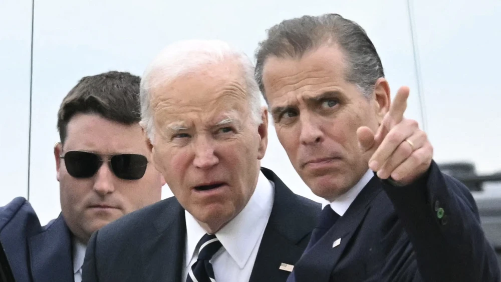 U.S. President Joe Biden talks with his son Hunter Biden upon arrival at Delaware Air National Guard Base in New Castle, Delaware, June 11, 2024, Photo by Andrew Caballero-Reynolds/AFP via Getty Images.