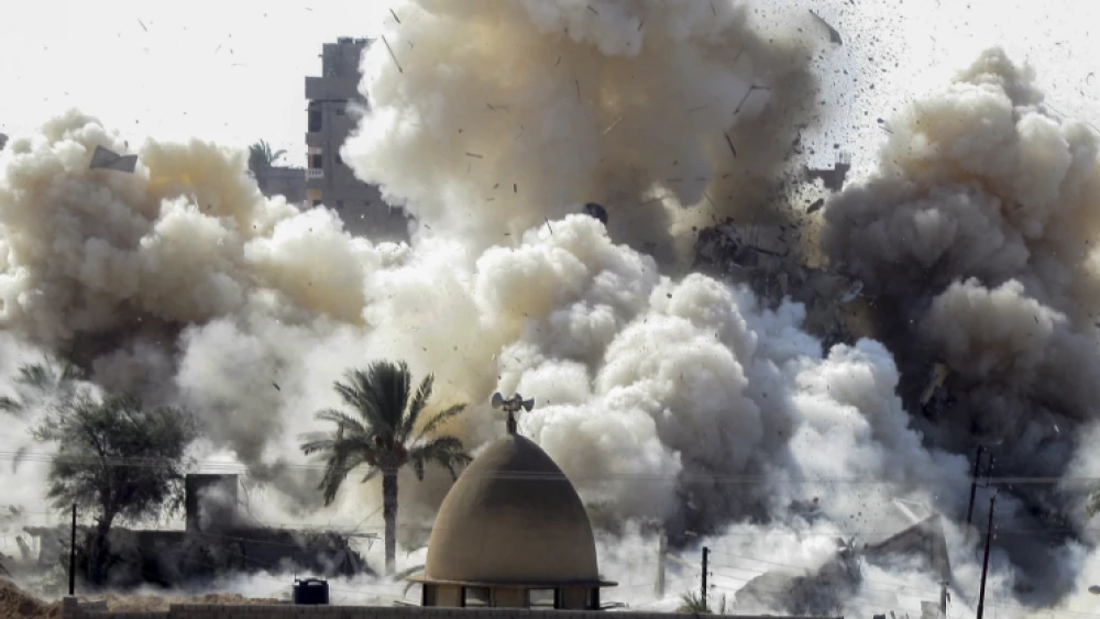 Smoke rises after a house was blown up during a military operation by Egyptian security forces in the Egyptian city of Rafah near the border with southern Gaza Strip, on Oct. 29, 2014. Photo by Abed Rahim Khatib/Flash90.