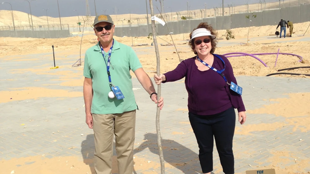 Rosaline and Alan Barron, both doctors from Newton, Mass., are encouraging planting trees in Israel for Tu B'Shevat. Credit: JNF.