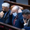 From left: Israeli Foreign Minister Yair Lapid, Prime Minister Naftali Bennett and Justice Minister Gideon Sa'ar attend a Knesset session, on July 6, 2021. Photo by Yonatan Sindel/Flash90.