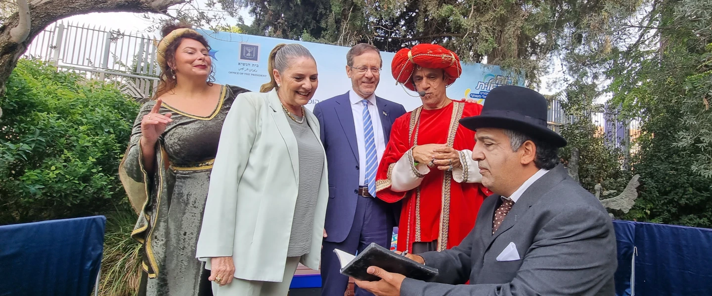 Israeli President Isaac Herzog and his wife, Michal, meet actors at a story-time station ahead of the annual Open Sukkah at the President’s Residence in Jerusalem, Sept. 29, 2026. Photo by Sharon Altshul.