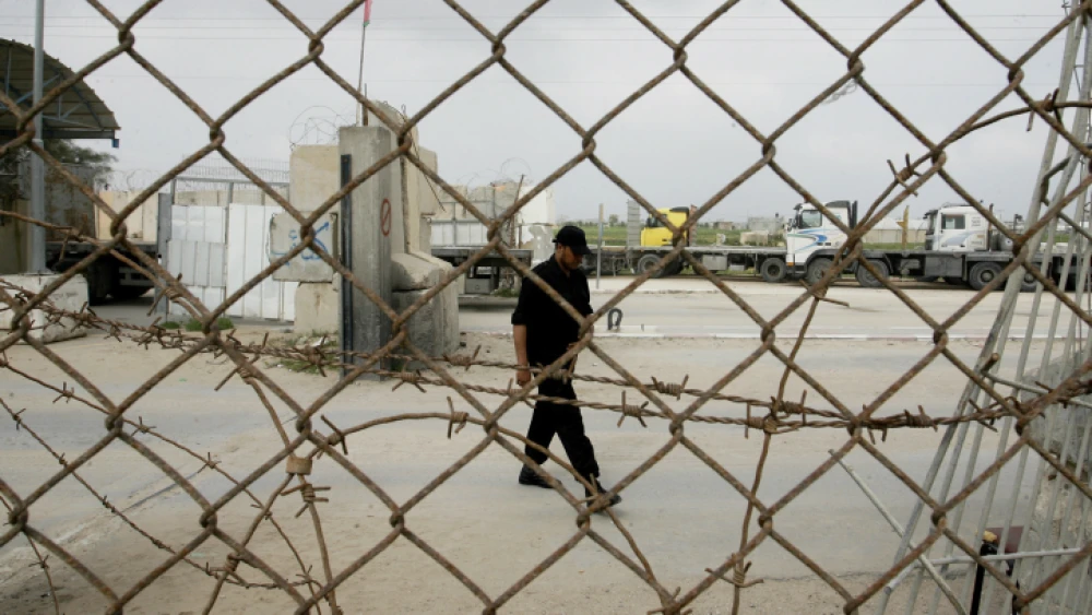 A member of the Hamas security forces stand guard at the Kerem Shalom crossing between Israel and the southern Gaza Strip on Feb. 24, 2014. Photo Abed Rahim Khatib/Flash90.