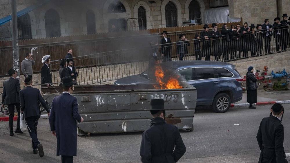 Ultra-Orthodox Jews block a road and clash with police during a protest against the autopsy of infants who died at an unlicensed daycare in Jerusalem, Jan. 20, 2026. Photo by Chaim Goldberg/Flash90.