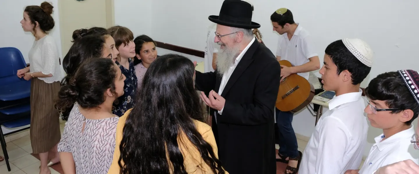 Tzfat Chief Rabbi Shmuel Eliyahu enjoys pre-Shabbat activities at the OneFamily Sleepaway camp in northern Israel in July 2019. Photo by Eytan Morgenstern.
