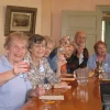 Community members make a toast at the St. Louis NORC ( Naturally Occurring Retirement Community). A group of Jewish federations started NORC communities in response to a federal initiative to develop replicable models to deal with the coming increase in the senior population. Credit: St. Louis NORC.